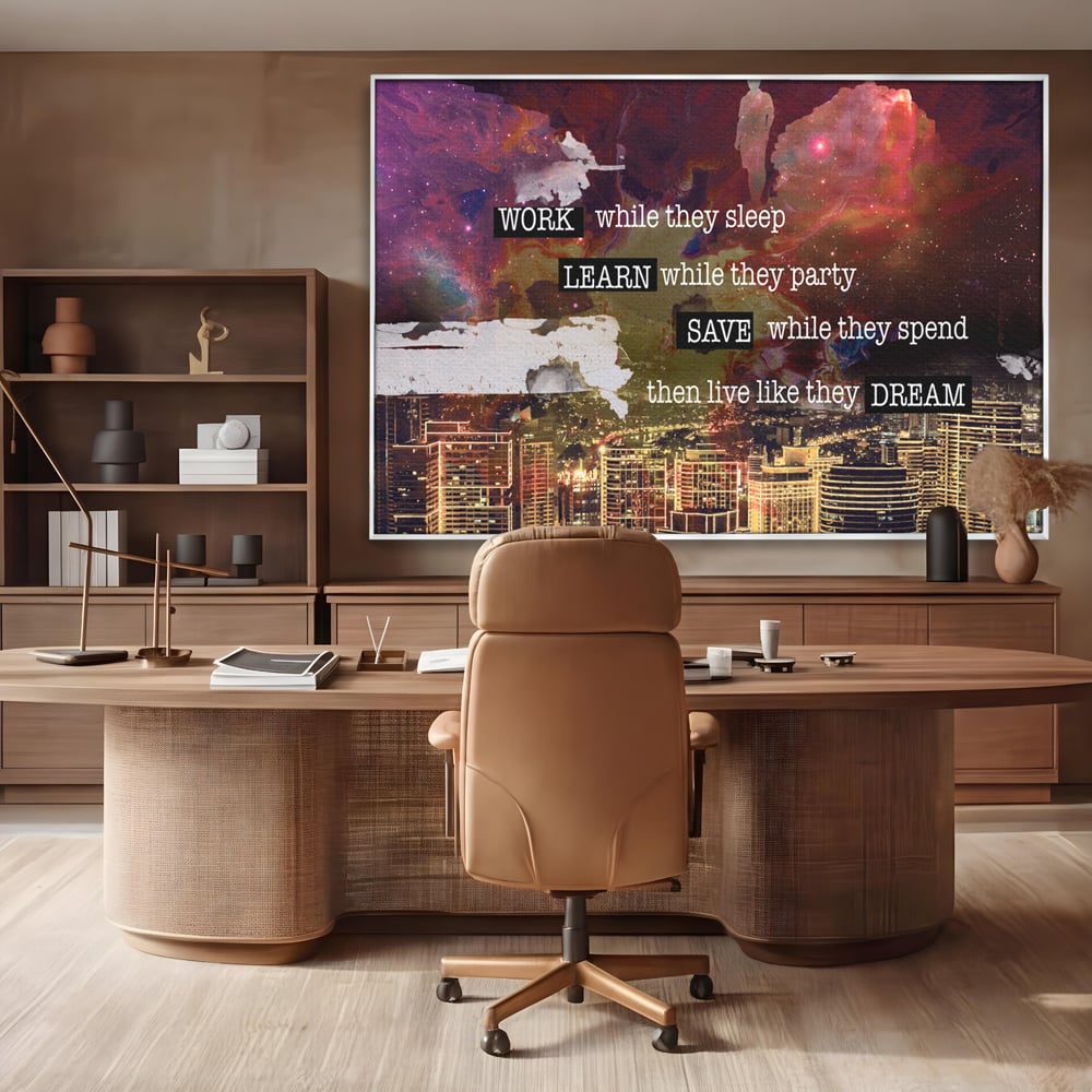 Tablou canvas cu tablou motivational cu oras si cer cosmic, in rama de aluminiu argintiu, pe perete intr-un birou